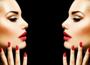 double girl with red lipstick and nails