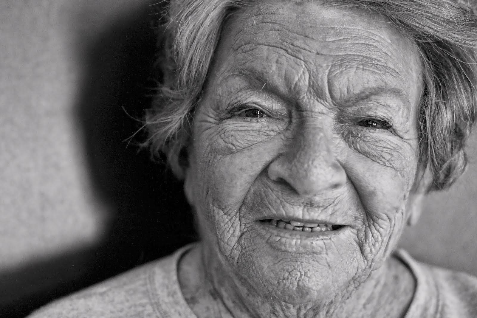 black and white of old wrinkled woman